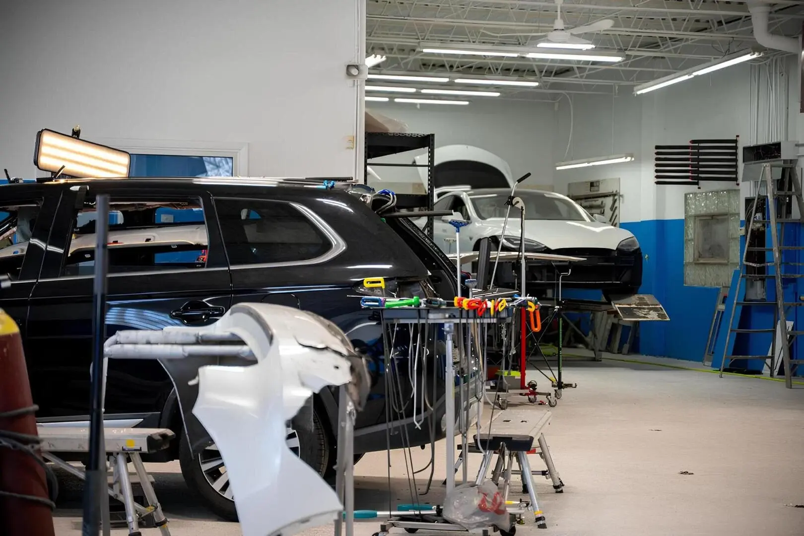 Car workshop with vehicles being repaired