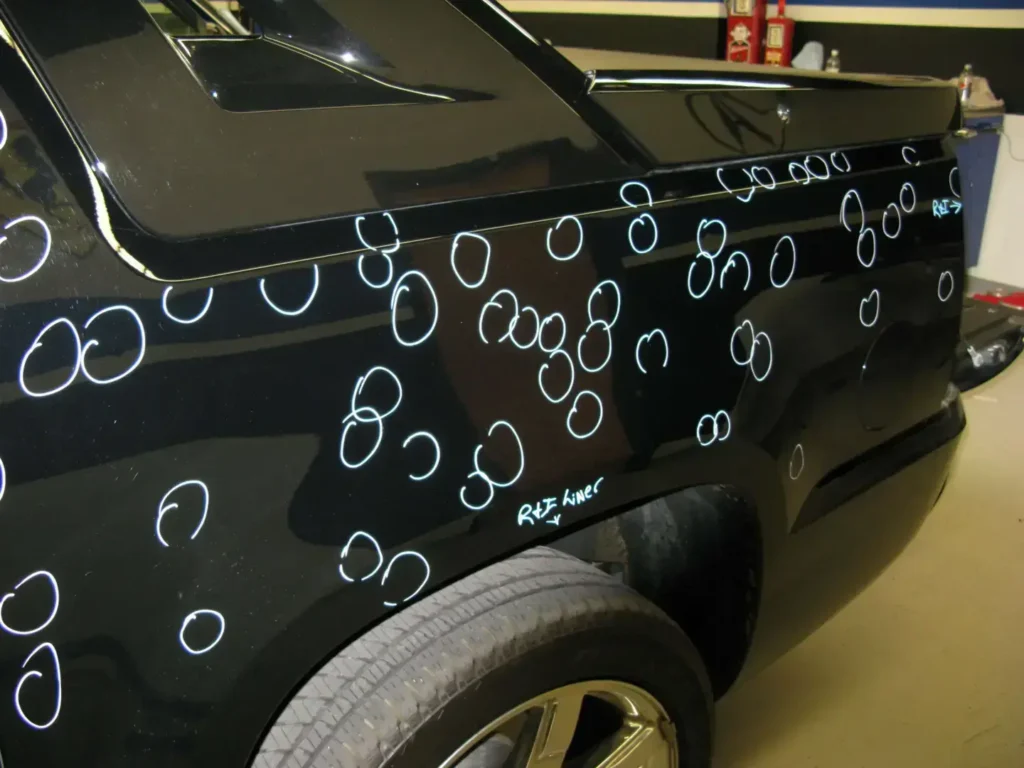 Car with numerous white circles