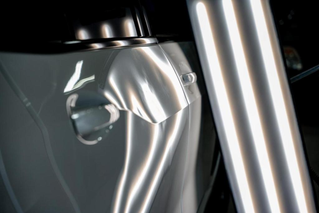 EZ Tech collision repair in Wheaton, IL, showcasing paintless dent removal process.
