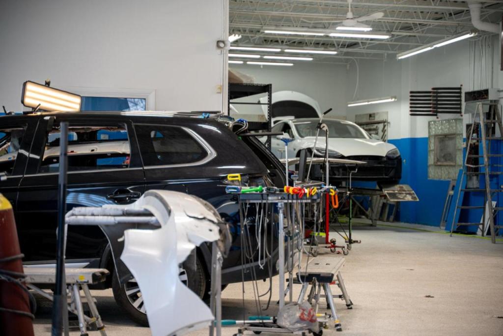 Collision repair shop with cars and repair tools for paintless dent repair and auto body work.